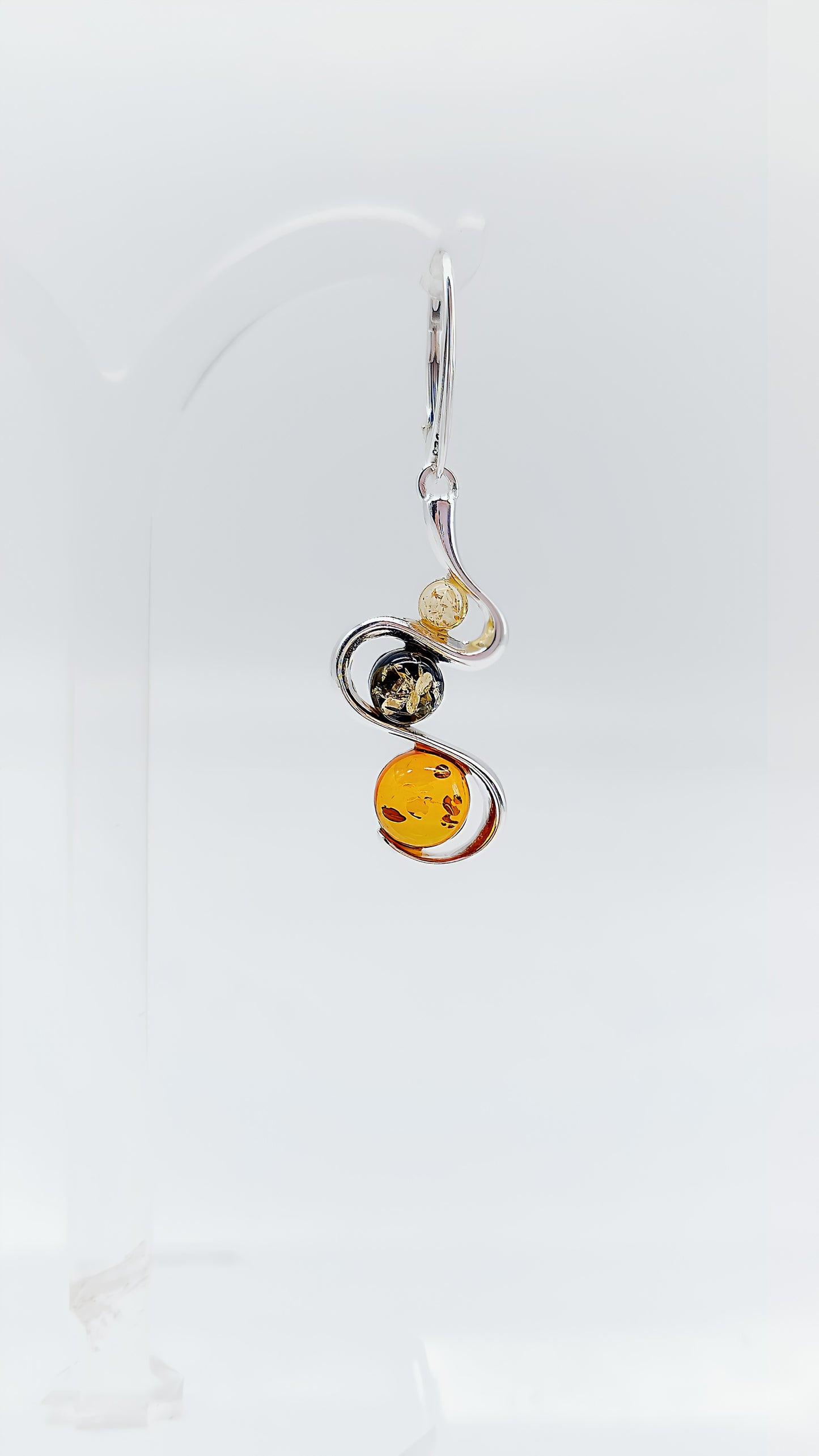 Three colors, one design: earrings with colorful amber