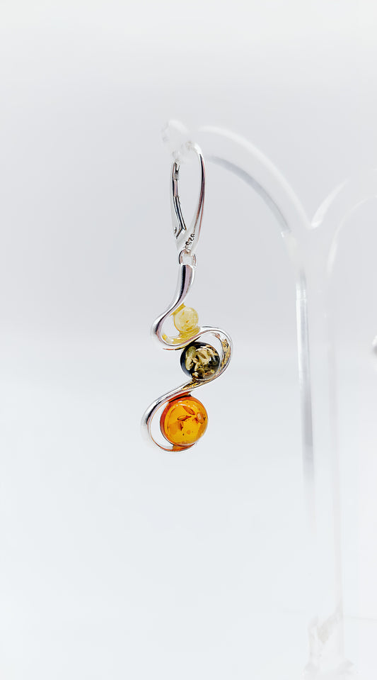 Three colors, one design: earrings with colorful amber