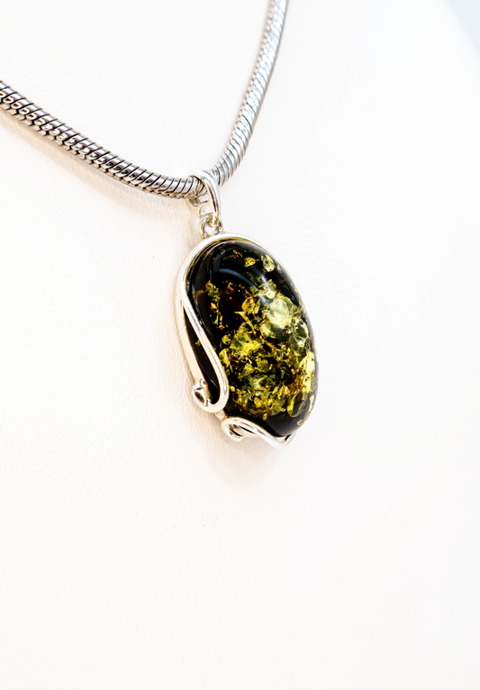 Jewelry made of genuine amber – oval pendant in silver setting
