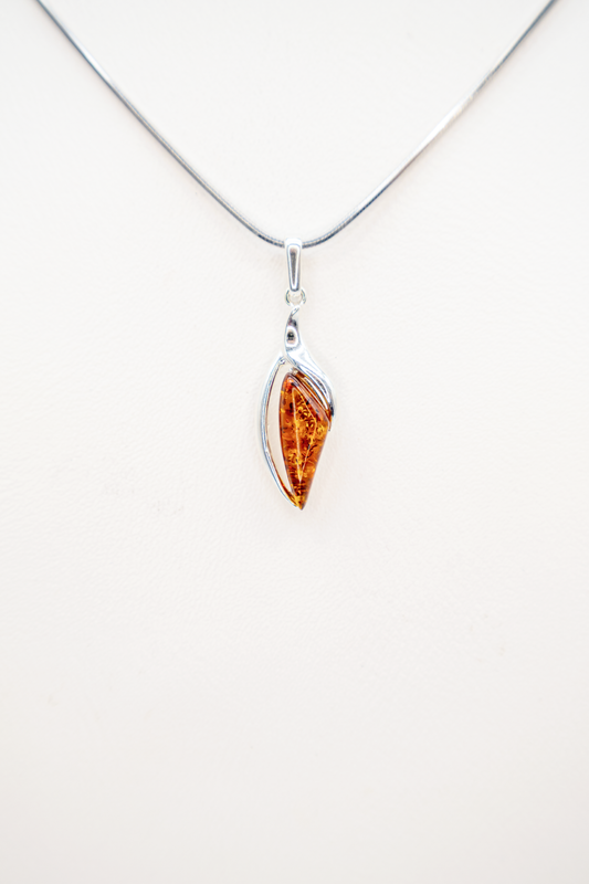 Modern amber pendant made of sterling silver