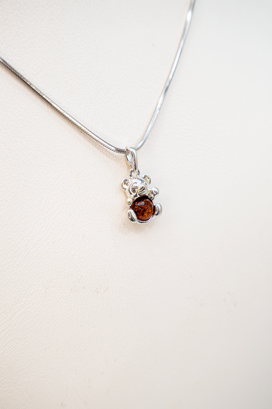 Cute teddy bear pendant made of silver with amber