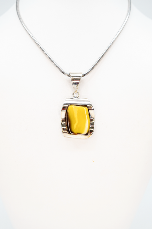 Jewelry pendant amber yellow modern silver setting