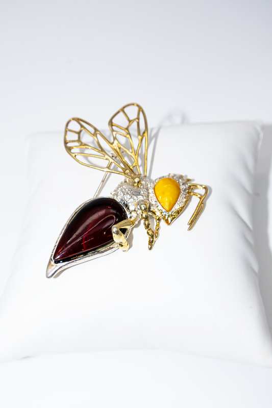 Unique bee brooch made of silver with amber
