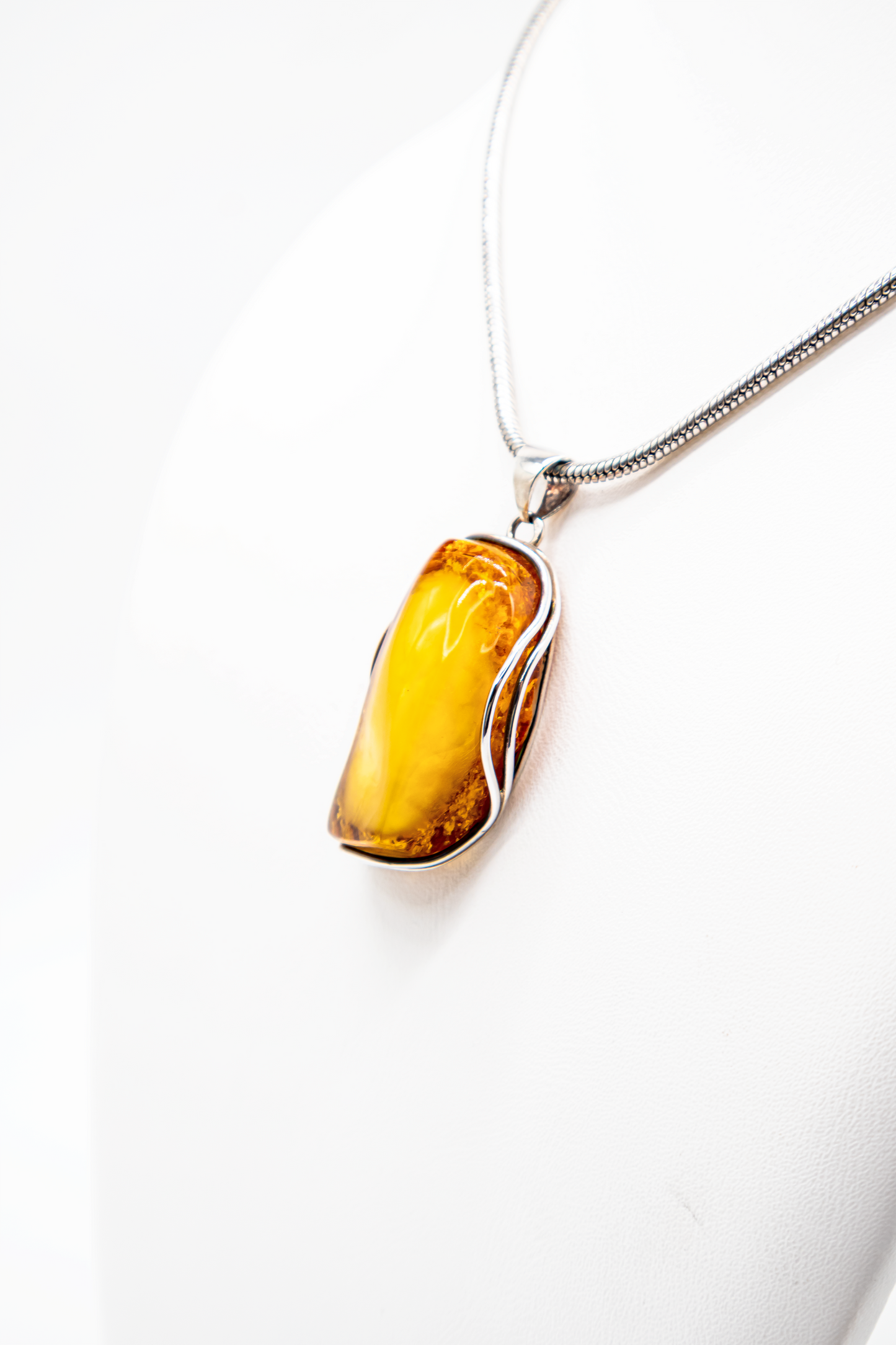 Amber artwork – elegant silver pendant for women