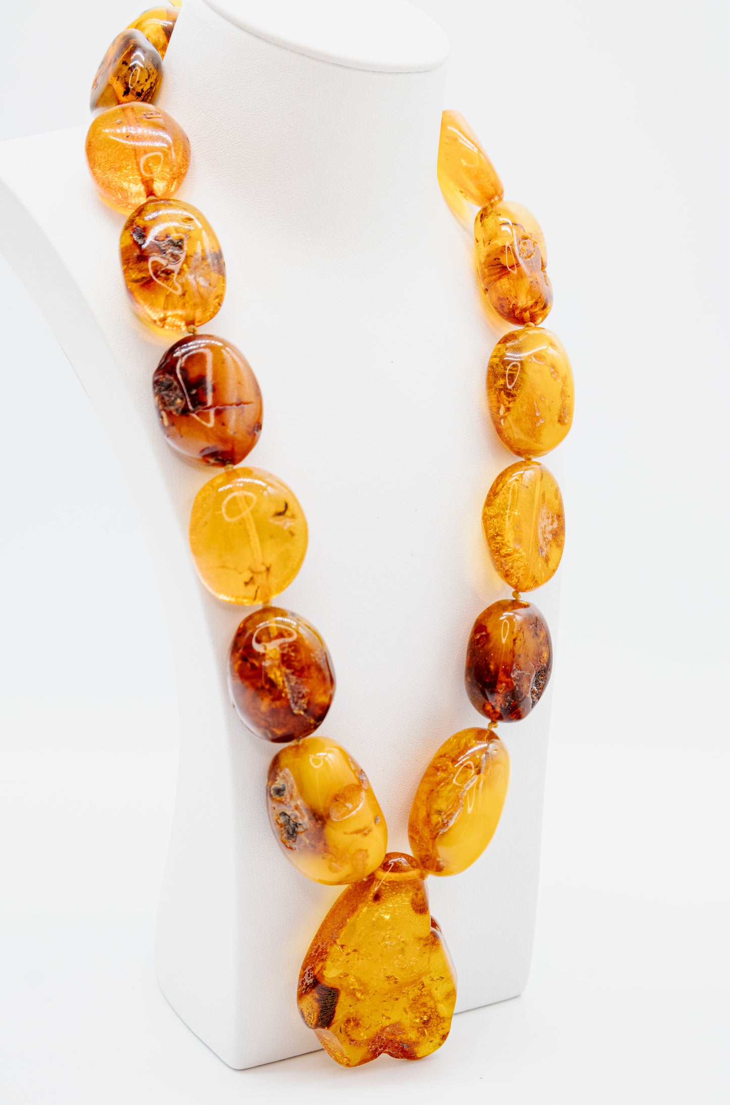 Unique amber necklace with a large center stone