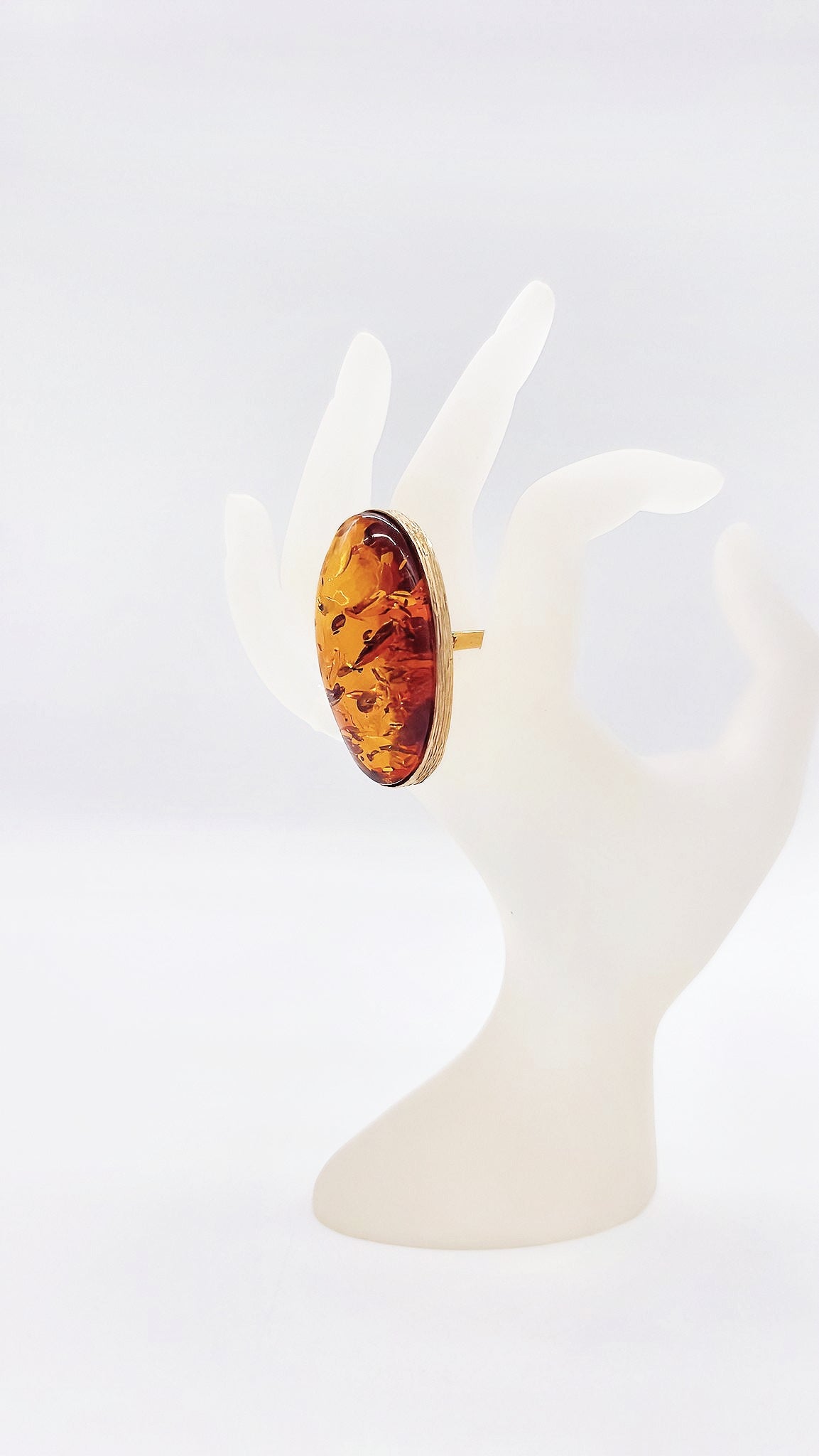 Unique ring: gold-plated silver with bright amber