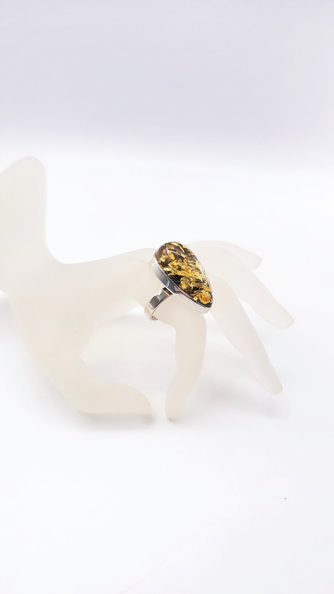 Unique jewelry: drop-shaped amber ring made of 925 silver