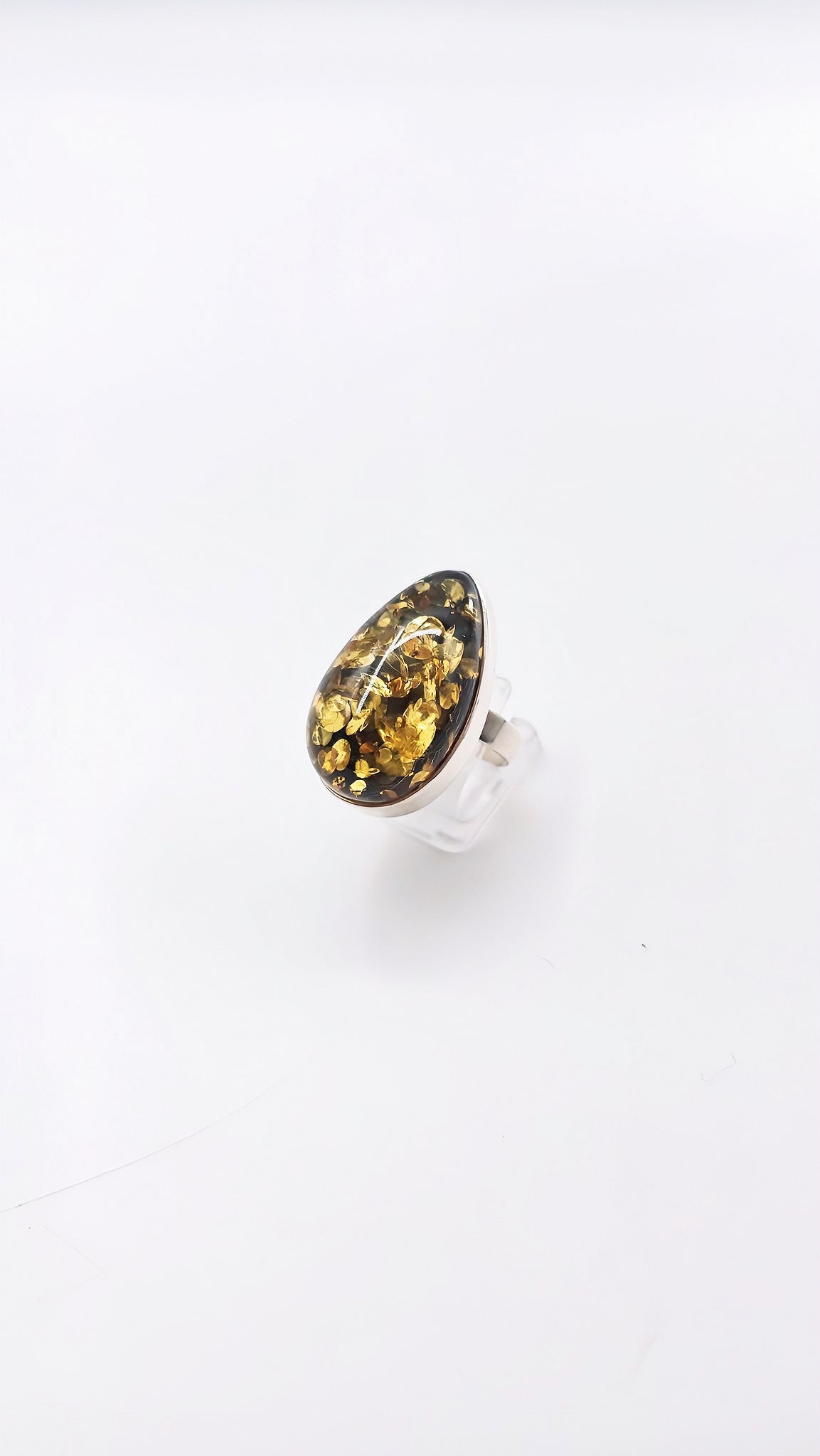 Unique jewelry: drop-shaped amber ring made of 925 silver