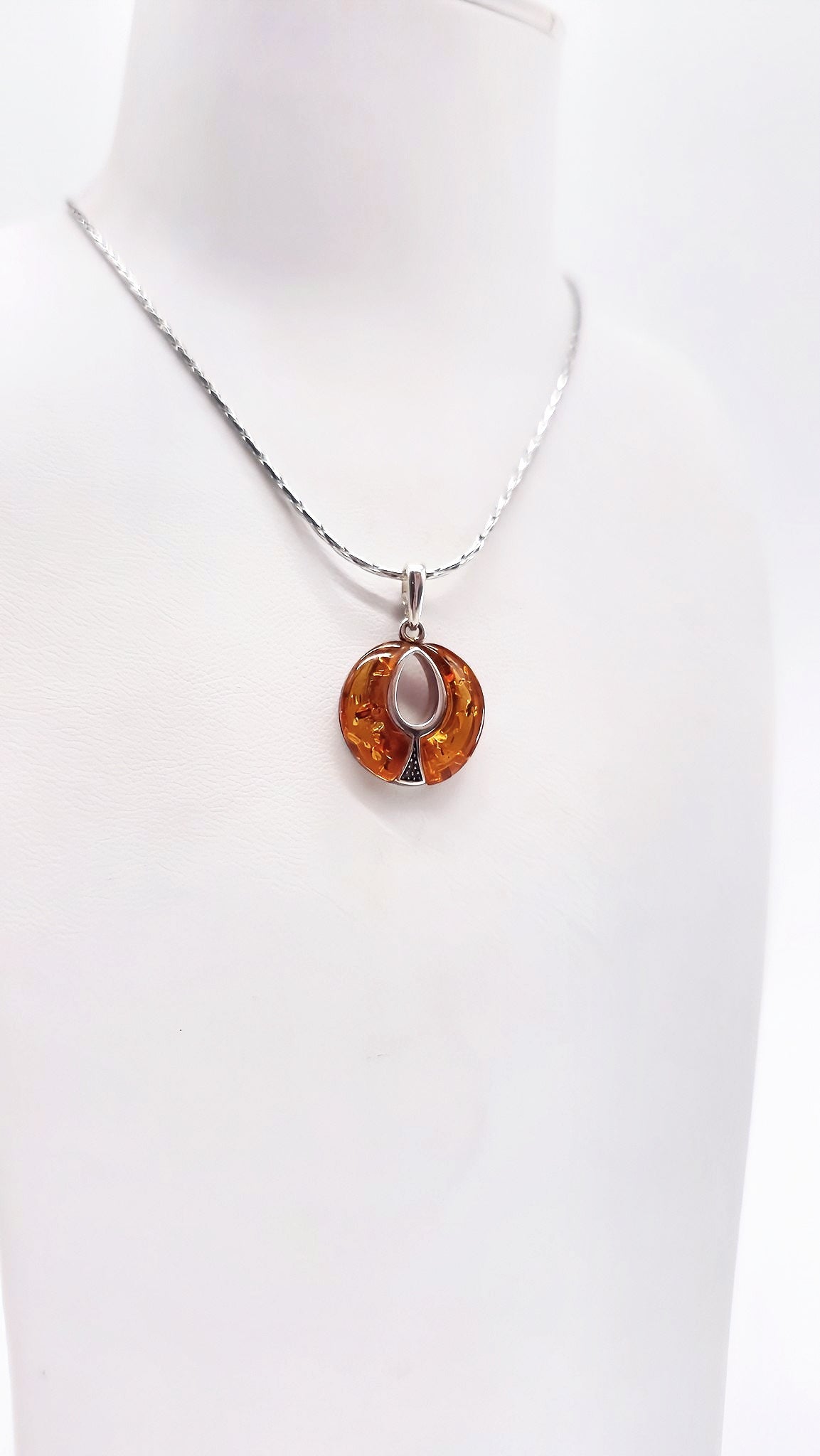 Elegant ladies' pendant made of natural amber and 925 silver