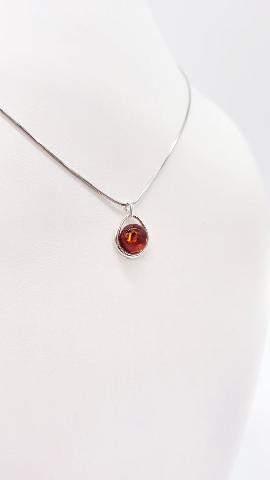 Silver pendant with genuine amber – oval drop