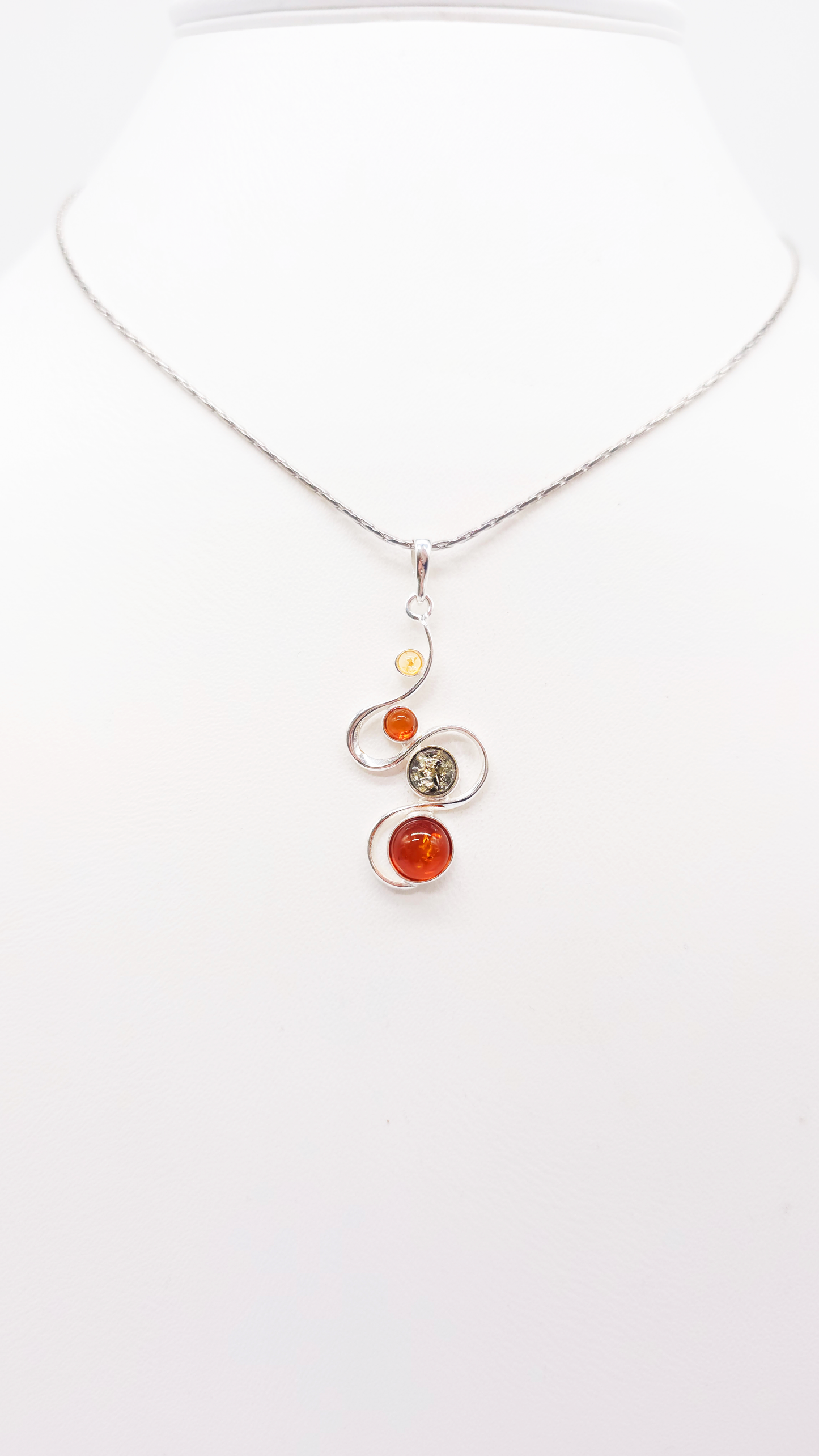 Pendant made of 925 sterling silver with three colorful amber stones