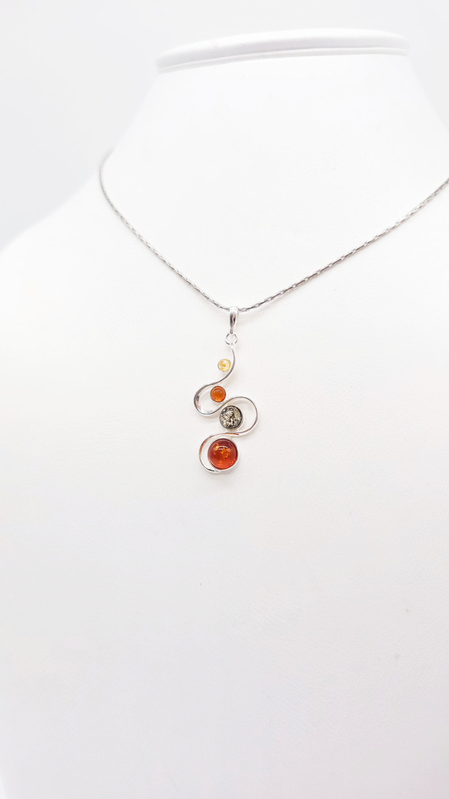 Pendant made of 925 sterling silver with three colorful amber stones