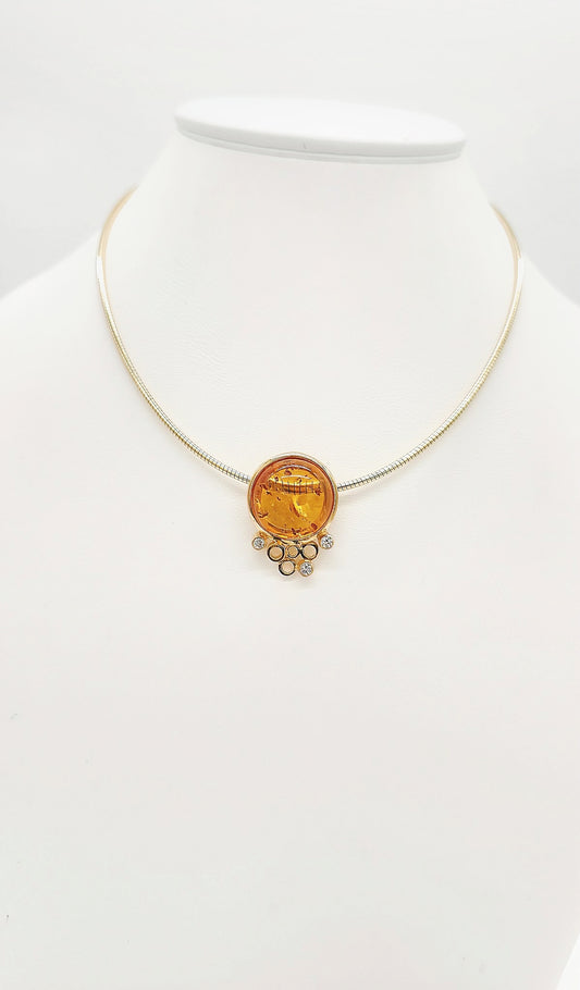 Elegant amber pendant with artistic setting