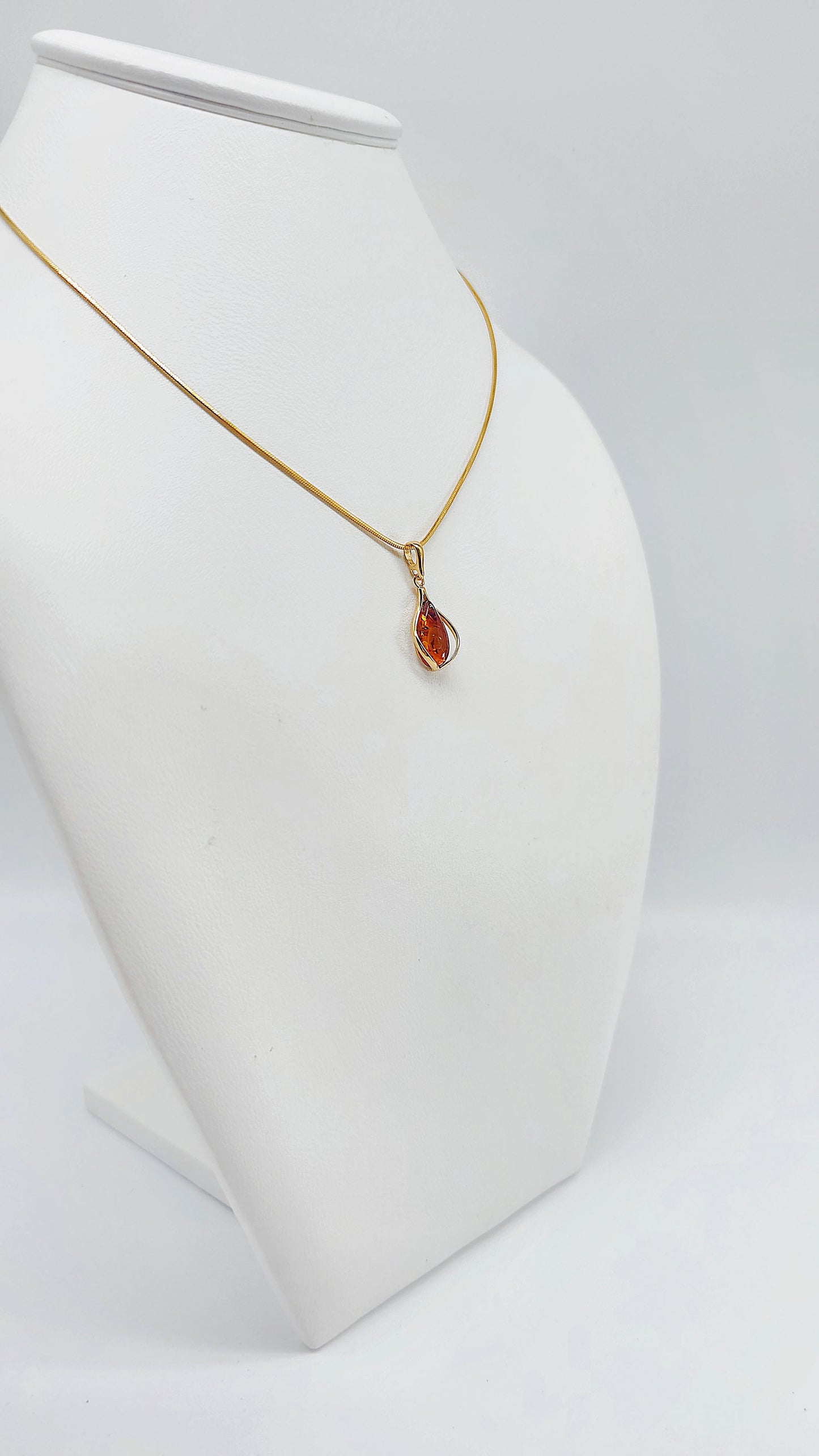 Jewelry set: Gold-plated necklace with genuine amber pendant