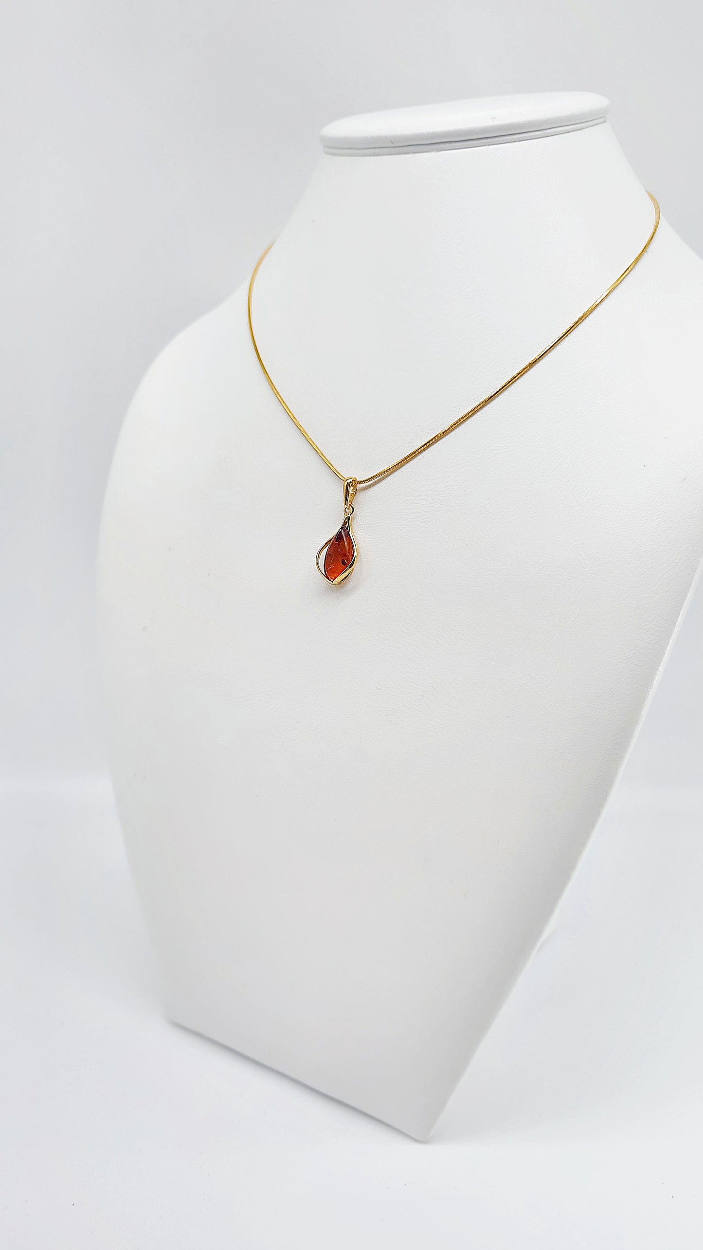 Jewelry set: Gold-plated necklace with genuine amber pendant
