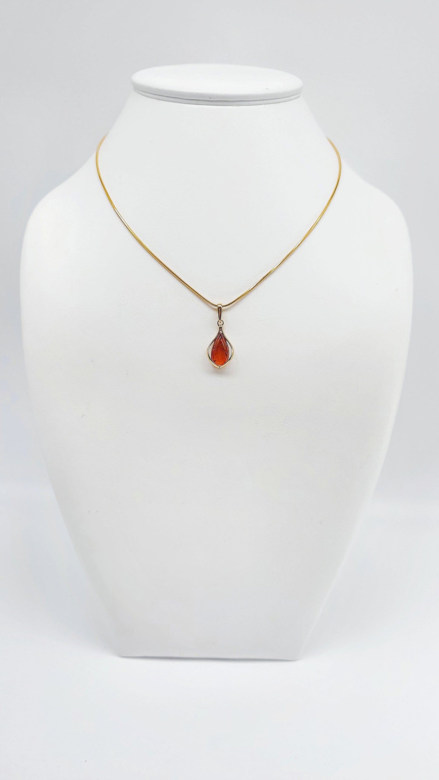 Jewelry set: Gold-plated necklace with genuine amber pendant