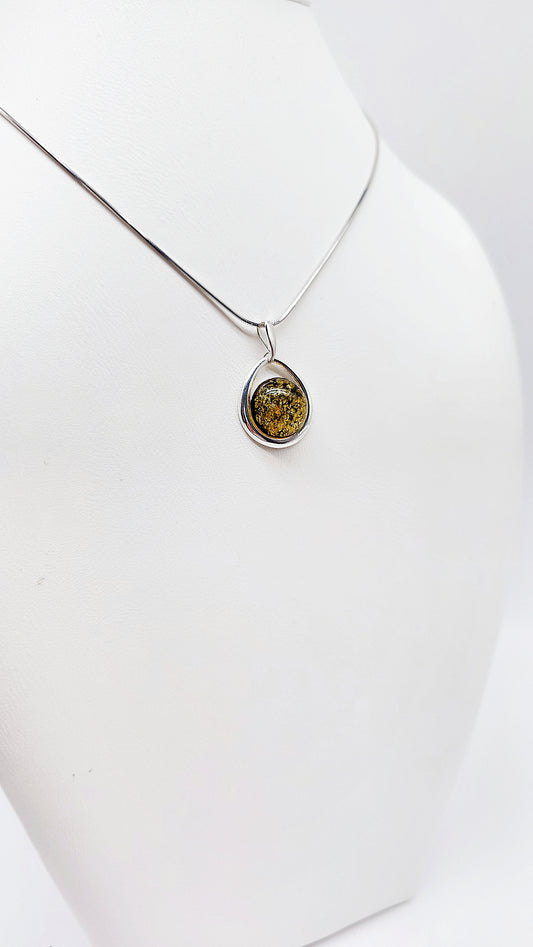 Silver pendant with green amber handmade