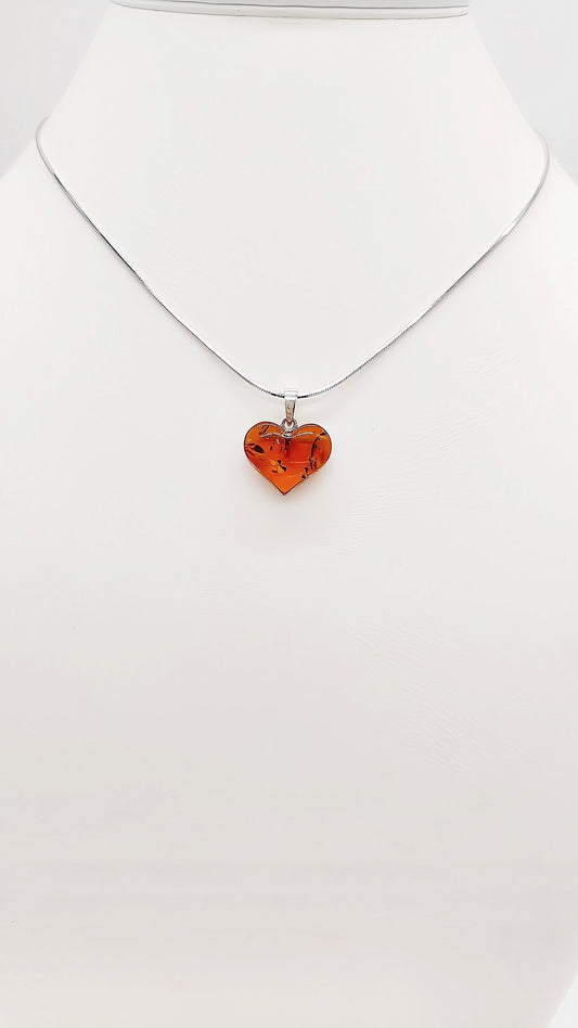 Heart pendant made of amber and sterling silver