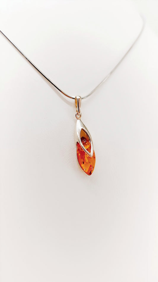 Elegant flame: amber in a silver frame