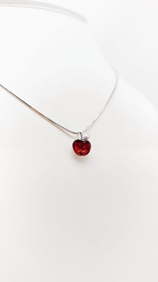 Sweet temptation: apple pendant made of amber and silver
