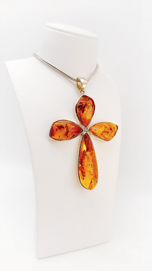 Symbol of hope: cross made of amber and sterling silver