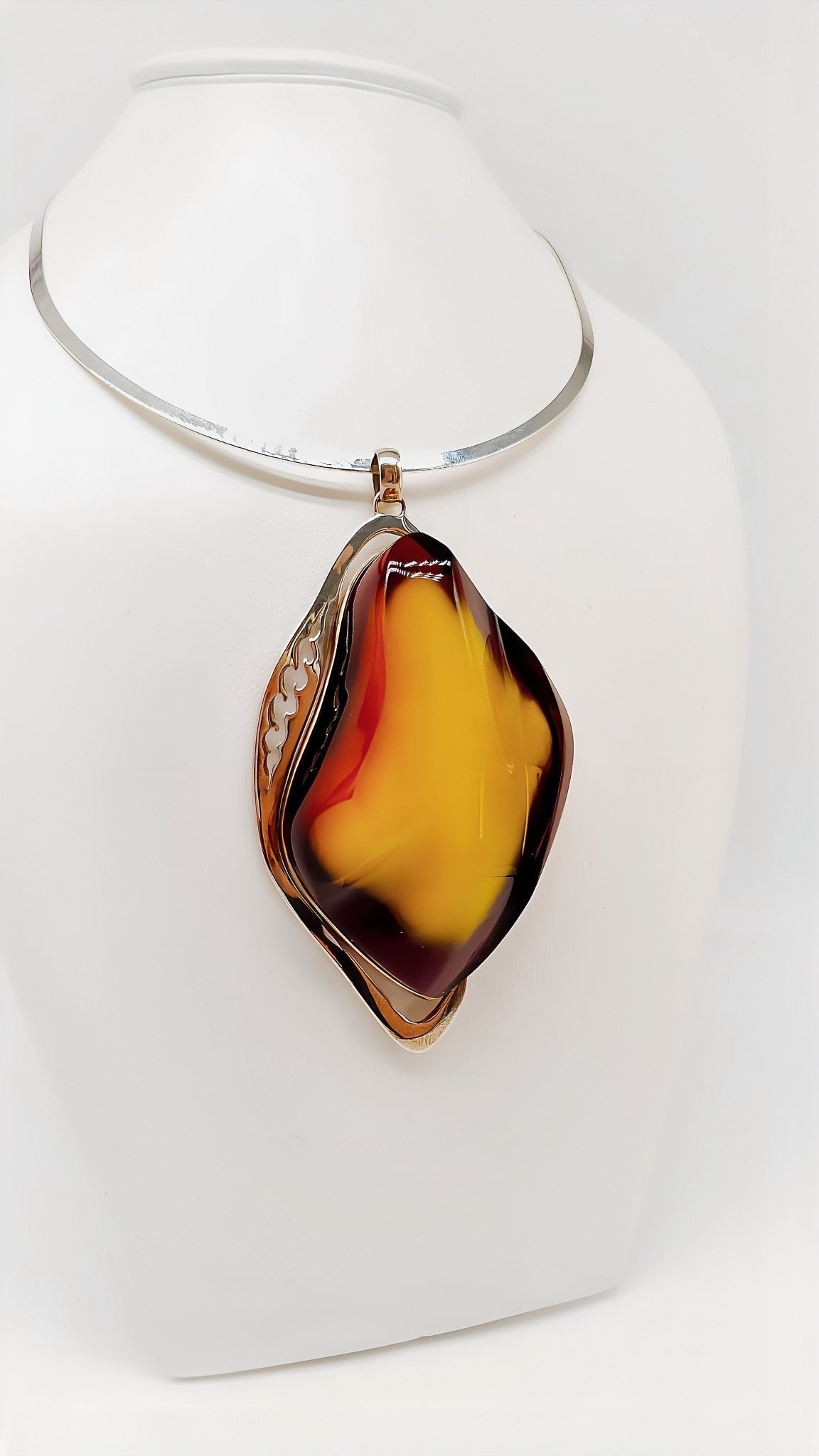 Mystical elegance: unique piece made of amber and silver