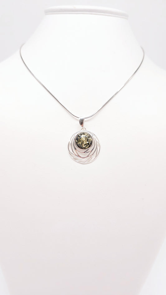 Exquisite round silver pendant with amber