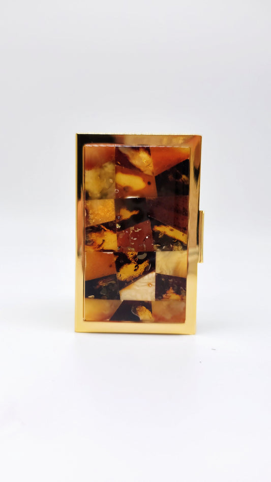 Gold-colored stainless steel card holder with amber – high-quality elegance