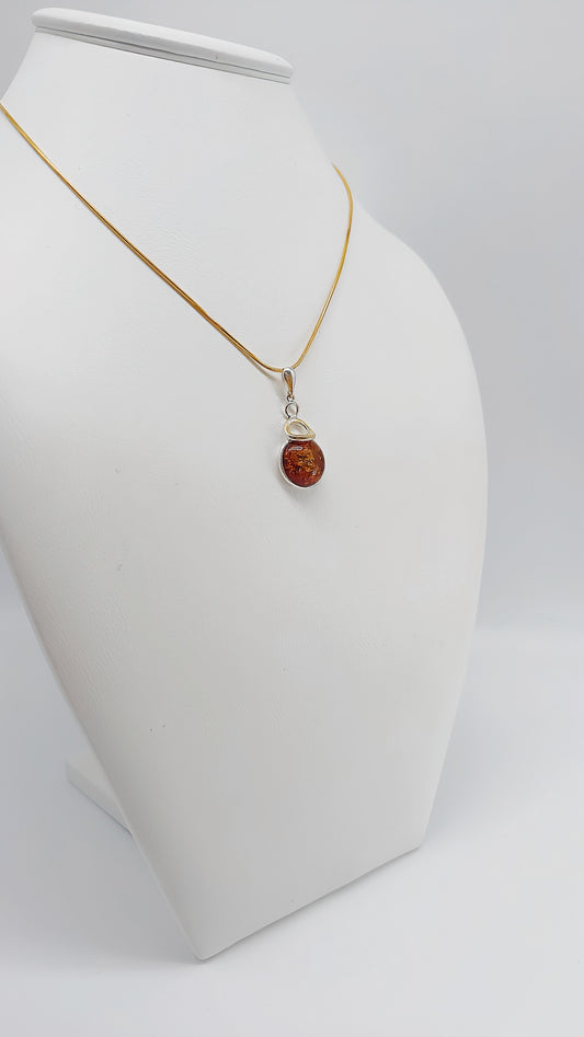 Classic silver pendant with sparkling amber