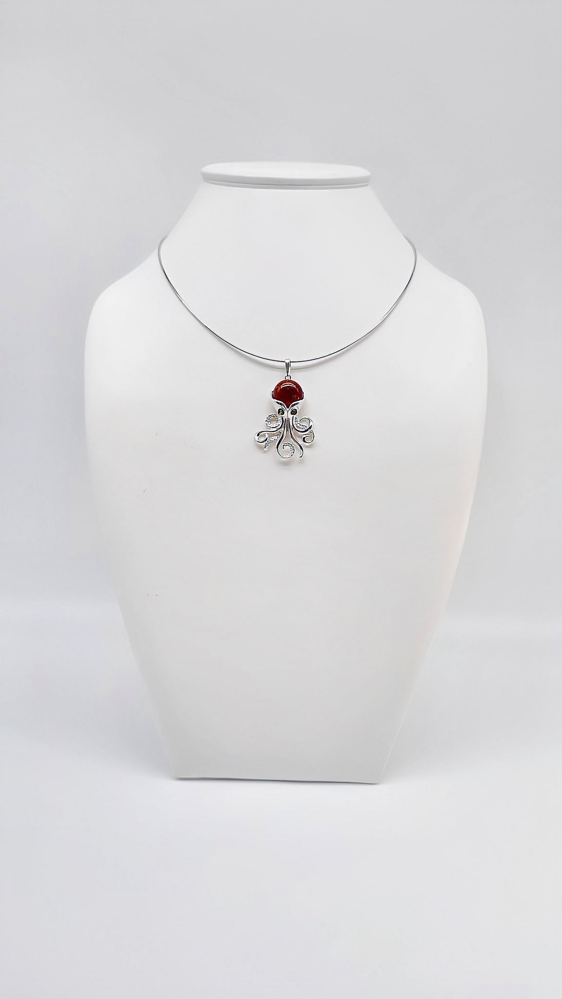 Silver octopus pendant with amber