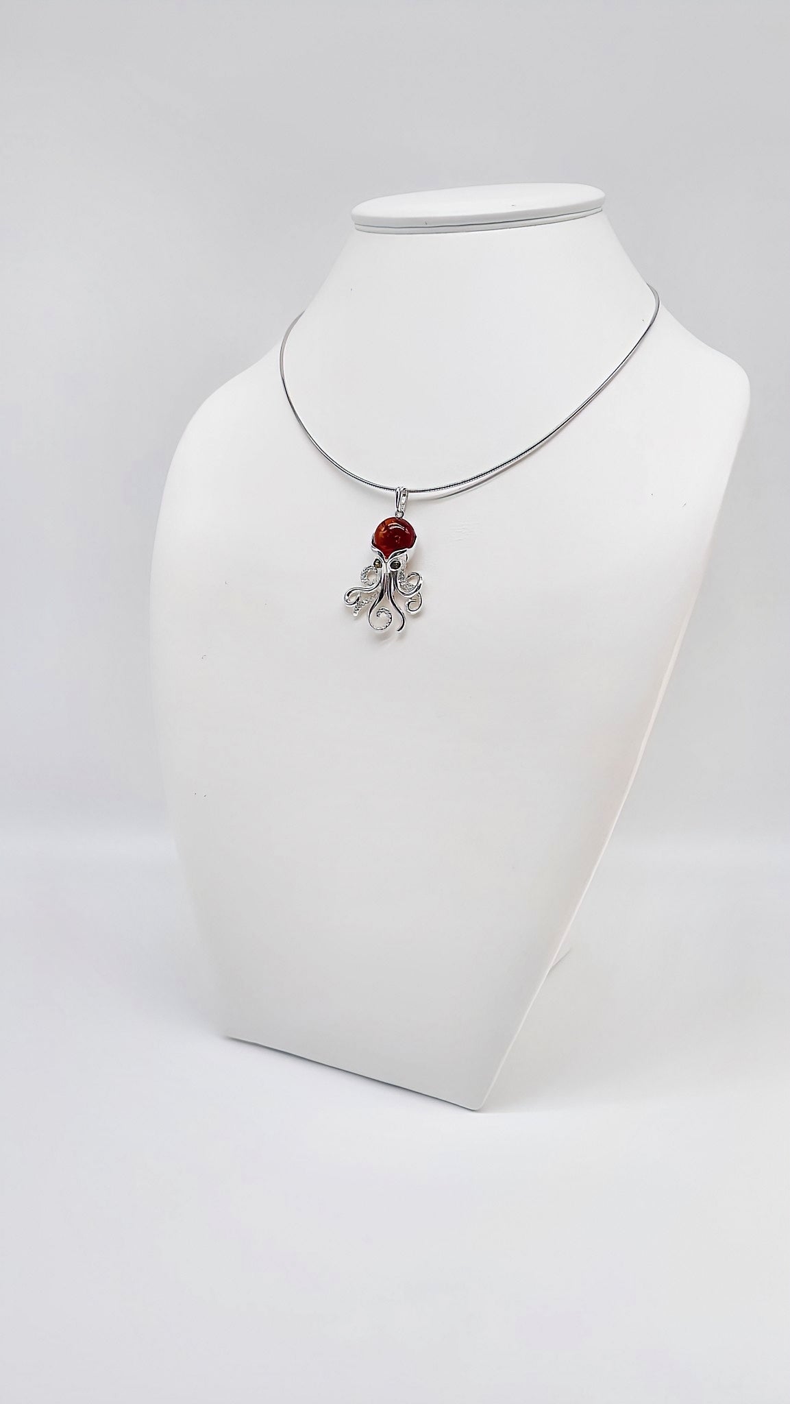 Silver octopus pendant with amber