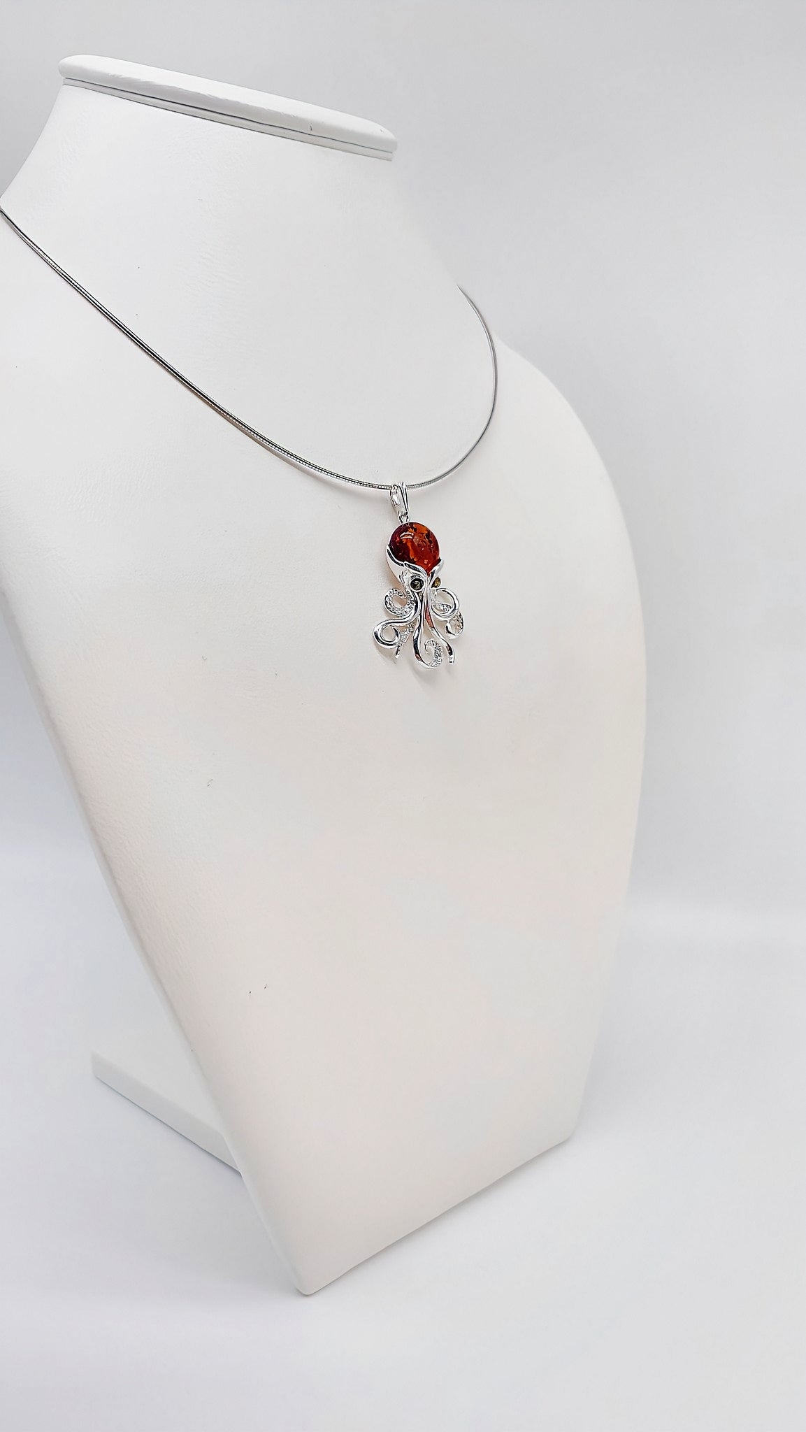 Silver octopus pendant with amber