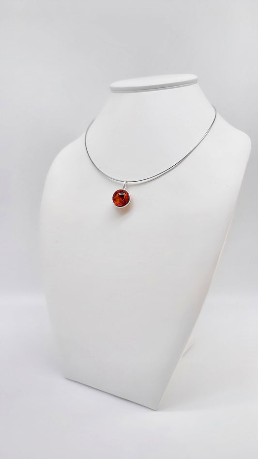 Elegant silver pendant with amber
