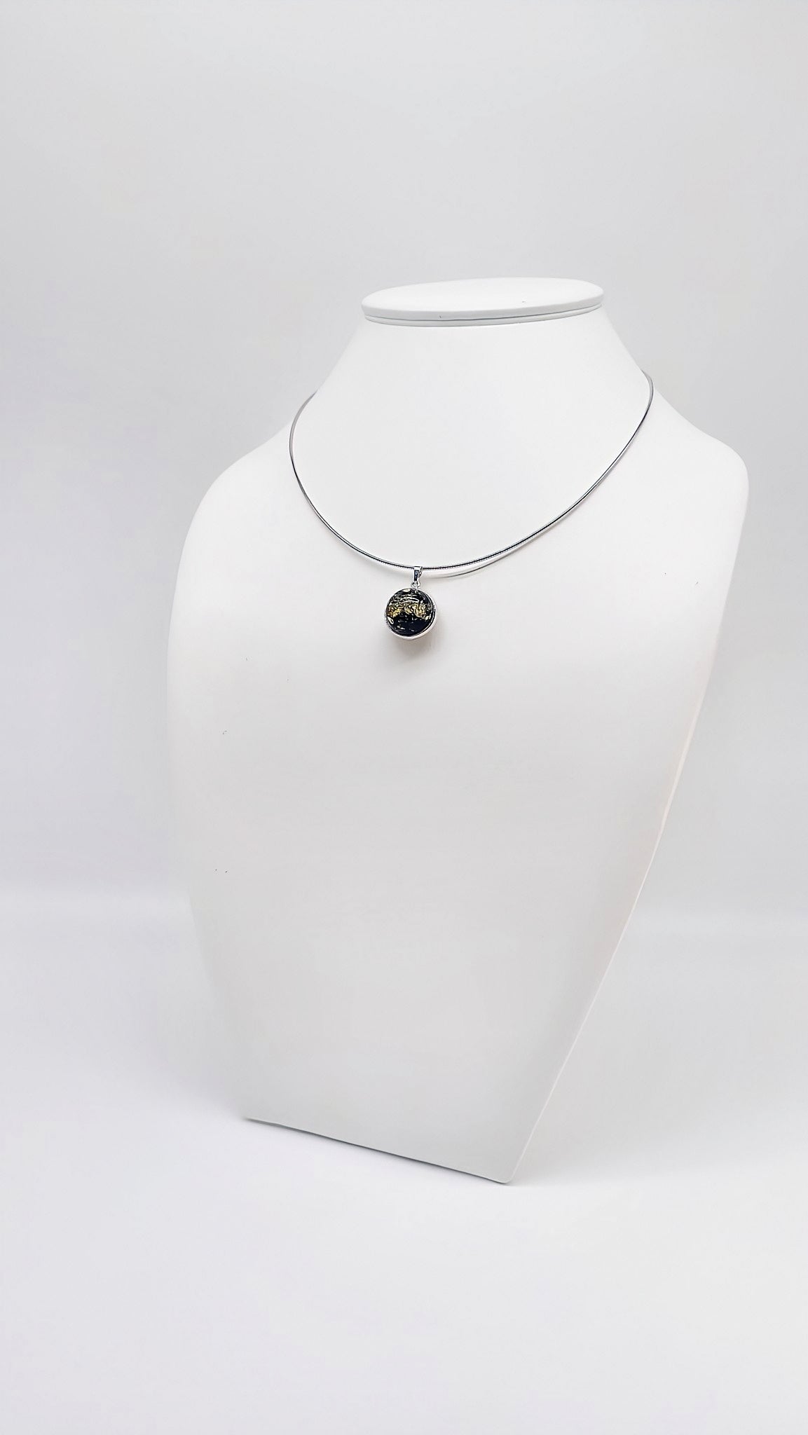 Timeless silver pendant with black amber