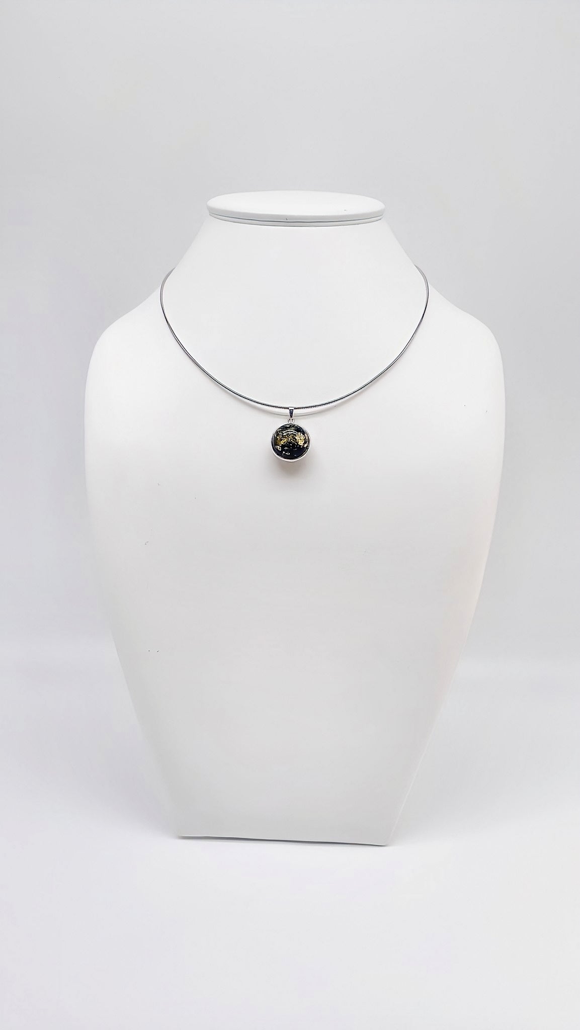 Timeless silver pendant with black amber