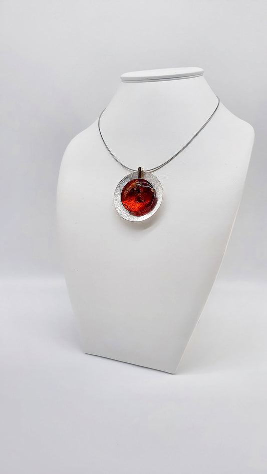 Modern silver pendant with amber