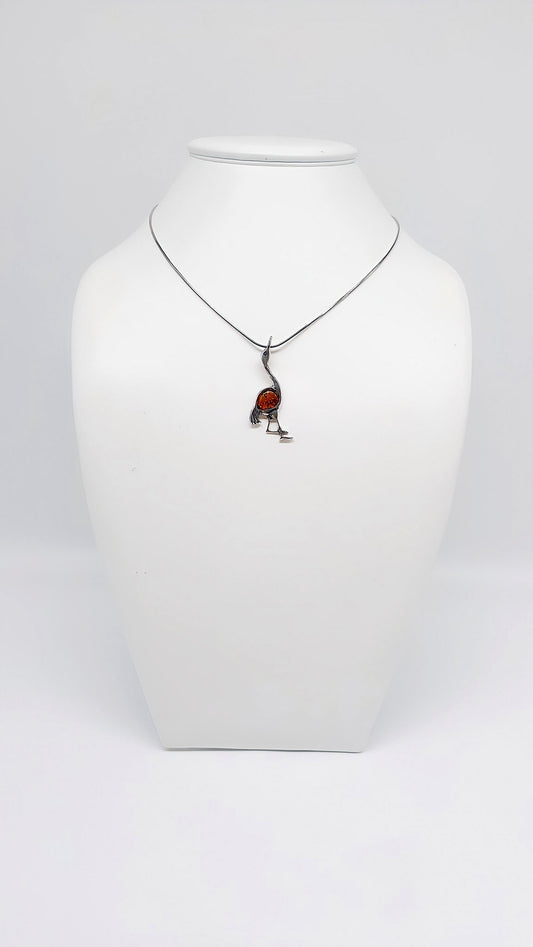 Noble crane jewelry made of silver and amber