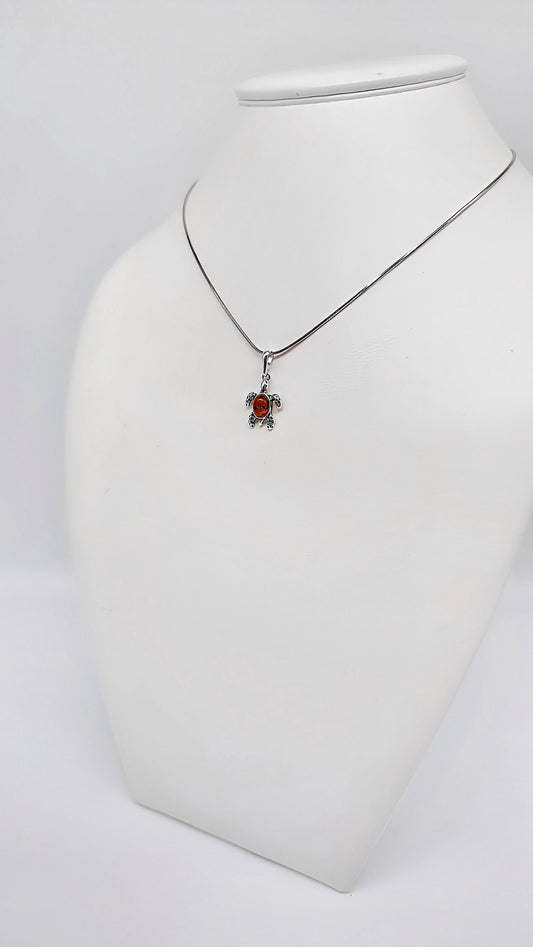 Elegant turtle pendant with bright amber