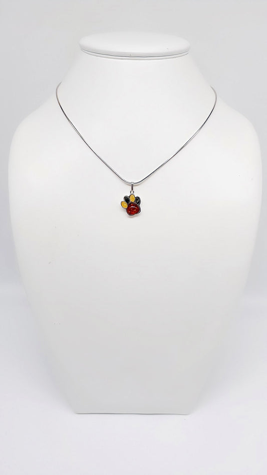 Silver paw pendant with colorful amber