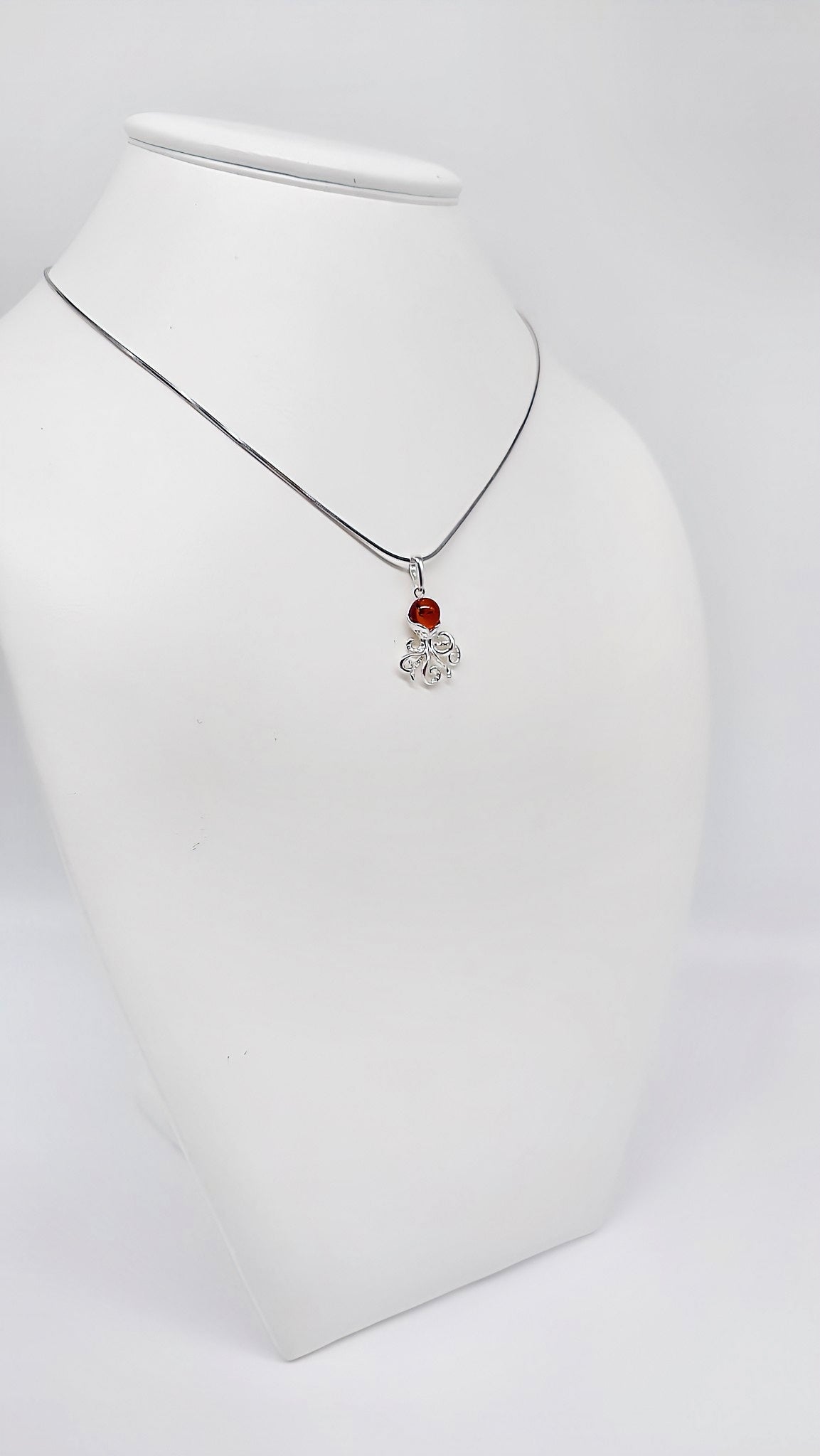 Exquisite octopus-shaped amber pendant