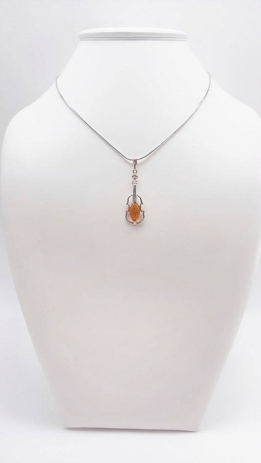 Musical elegance: violin pendant with amber
