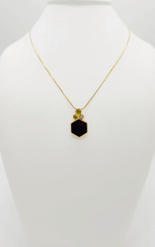 Pentagonal amber pendant in gold-plated silver