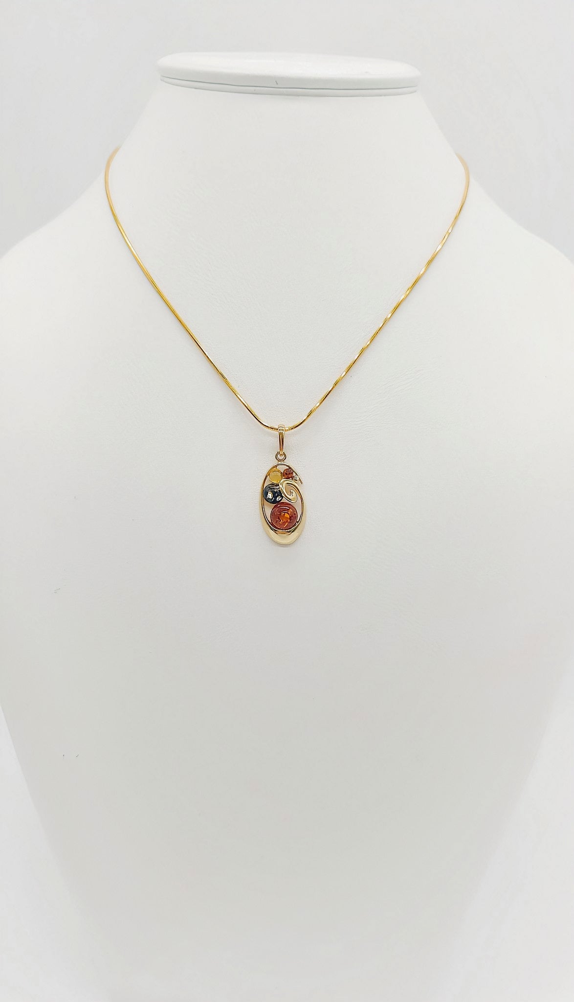 Filigree pendant made of gold-plated silver with amber