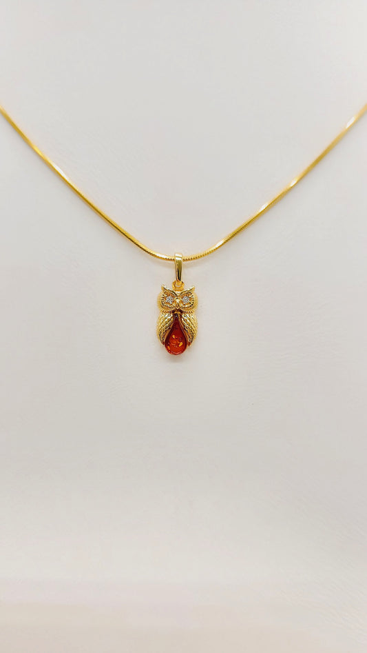Owl pendant made of gold-plated silver with amber