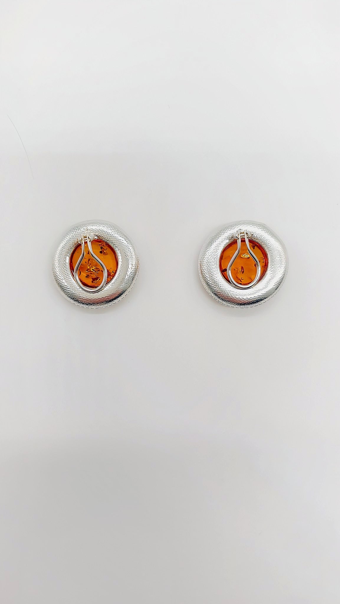 Round amber ear clips made of 925 sterling silver