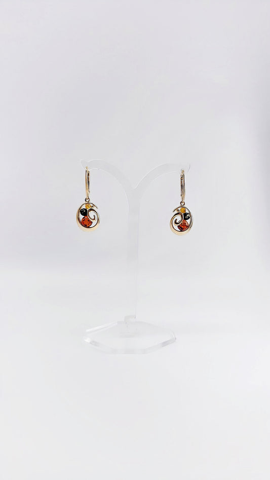 Gold-plated amber earrings with interesting details