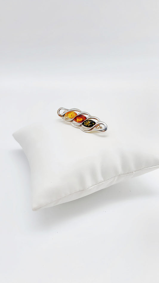 Stylish silver amber brooch with three shades