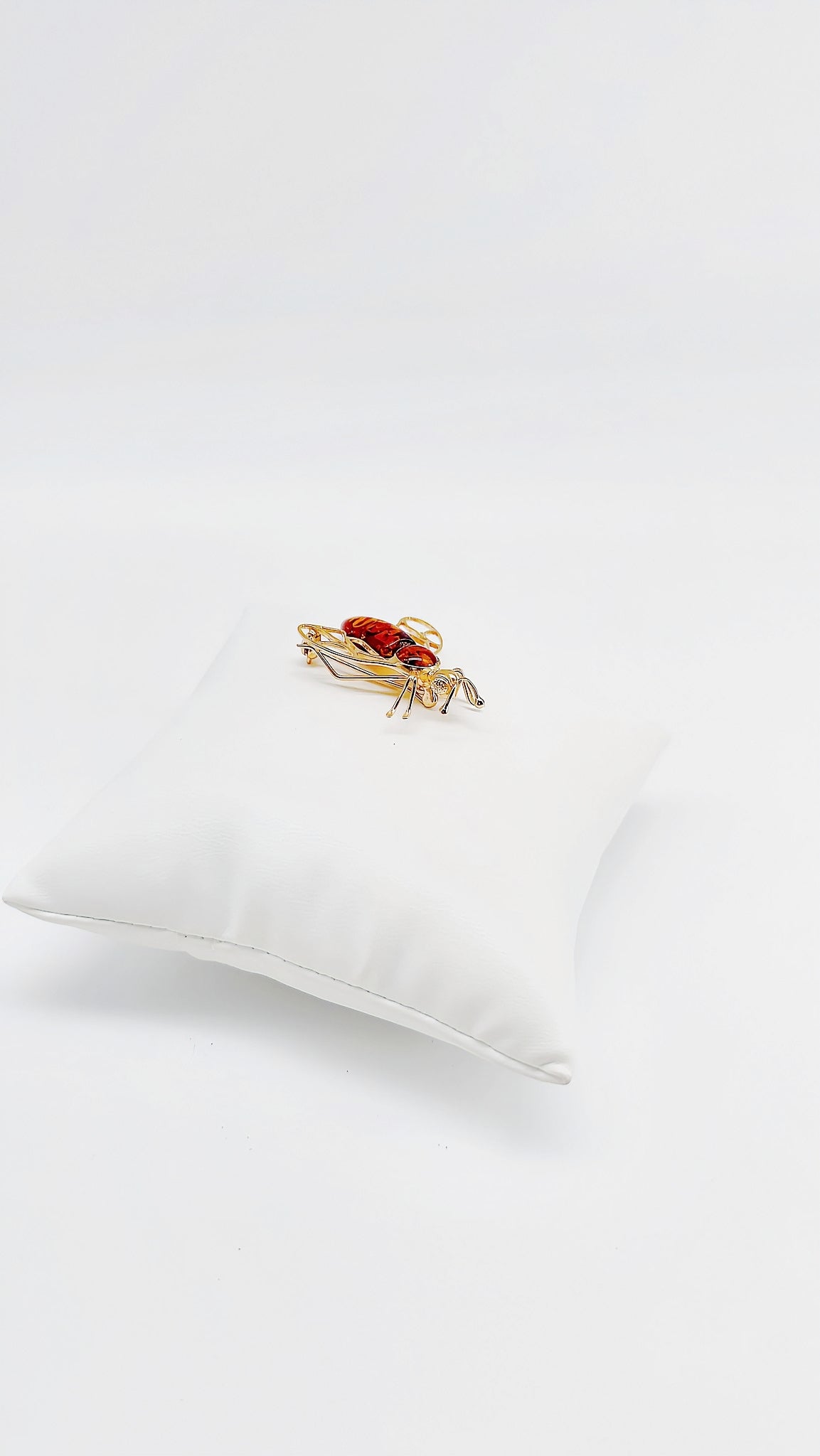 Gold-plated fly brooch with amber