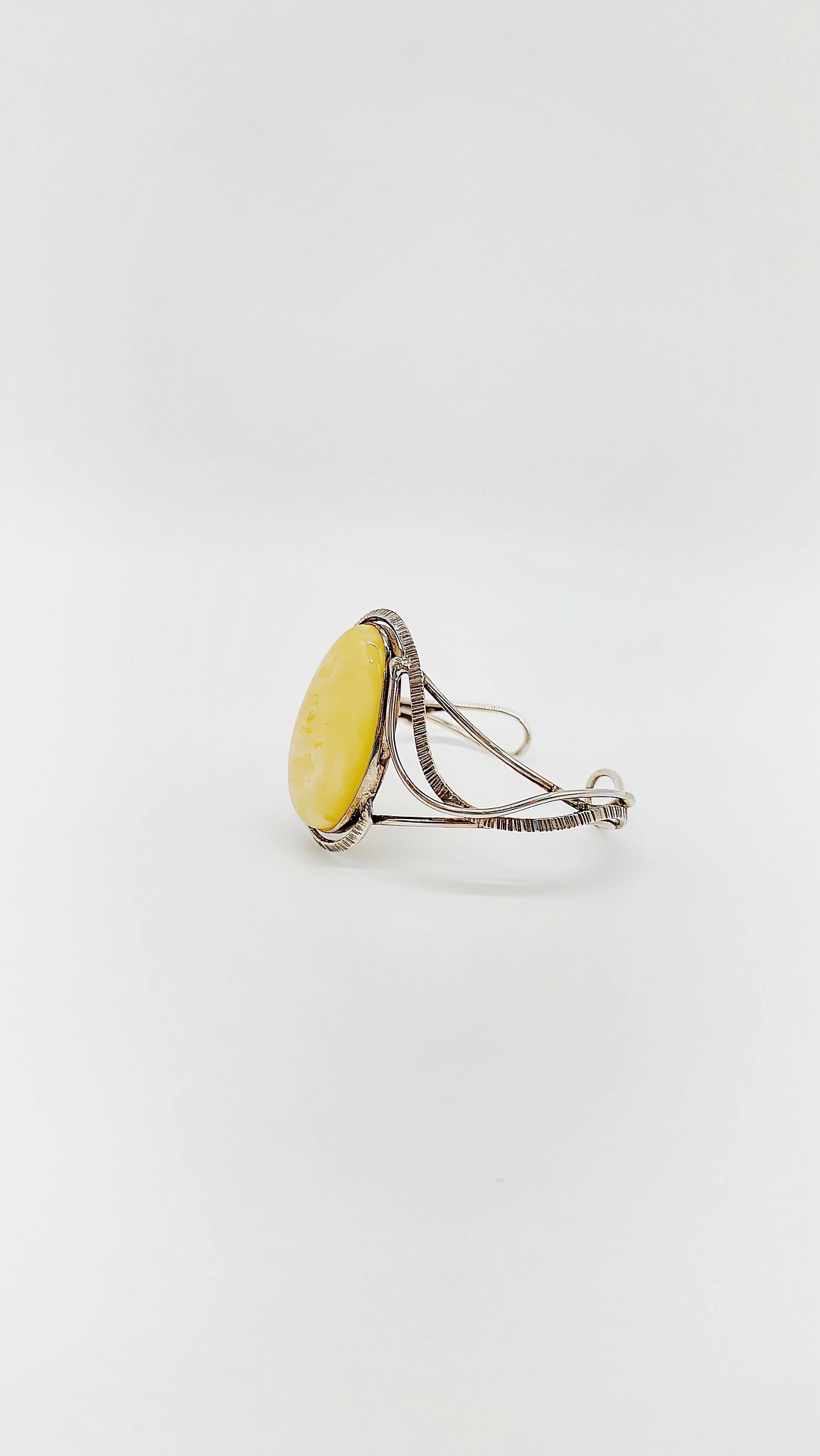 Silver bangle with honey-colored amber