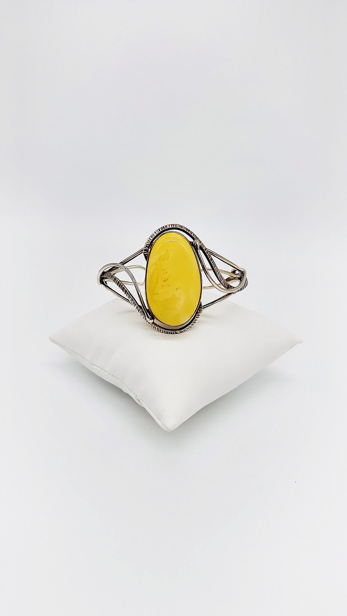 Silver bangle with honey-colored amber